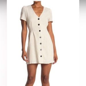 Short white/canvas dress with black buttons